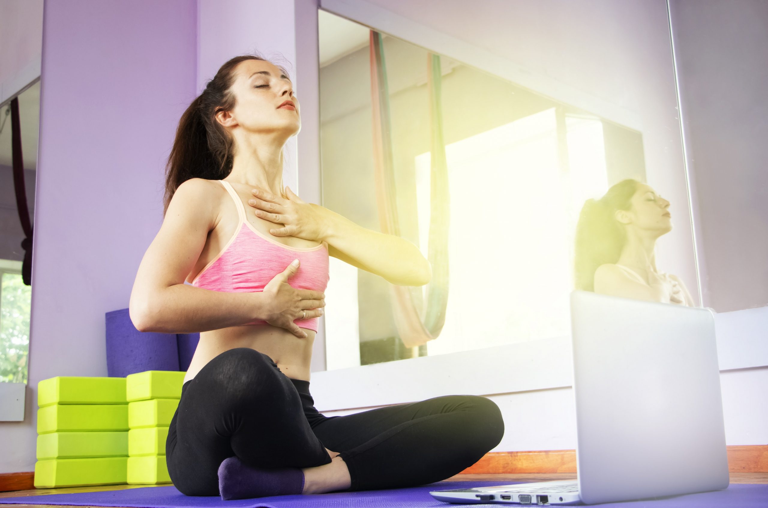 fitness-yoga-trainer-teaches-laptop